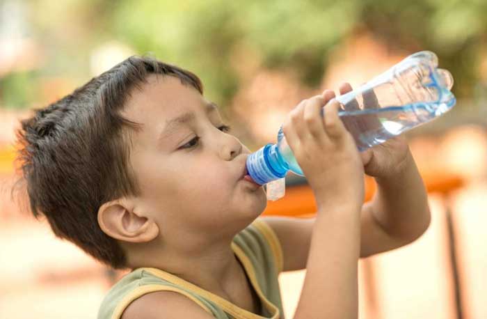 Image of a child demonstrating eye hydration techniques to maintain healthy eyesight